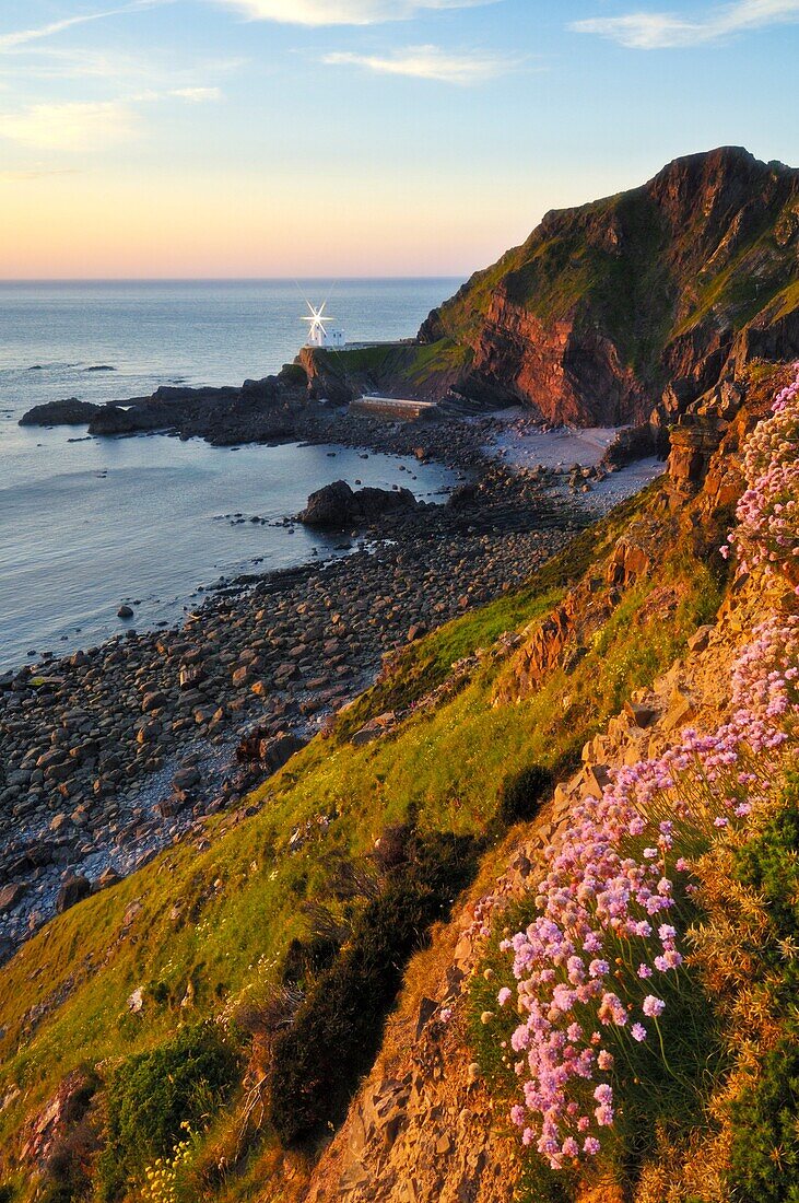 Hartland Point Lighthouse on the Hartland peninsula Heritage Coast in North Devon, in summer evening sunlight England, United Kingdom