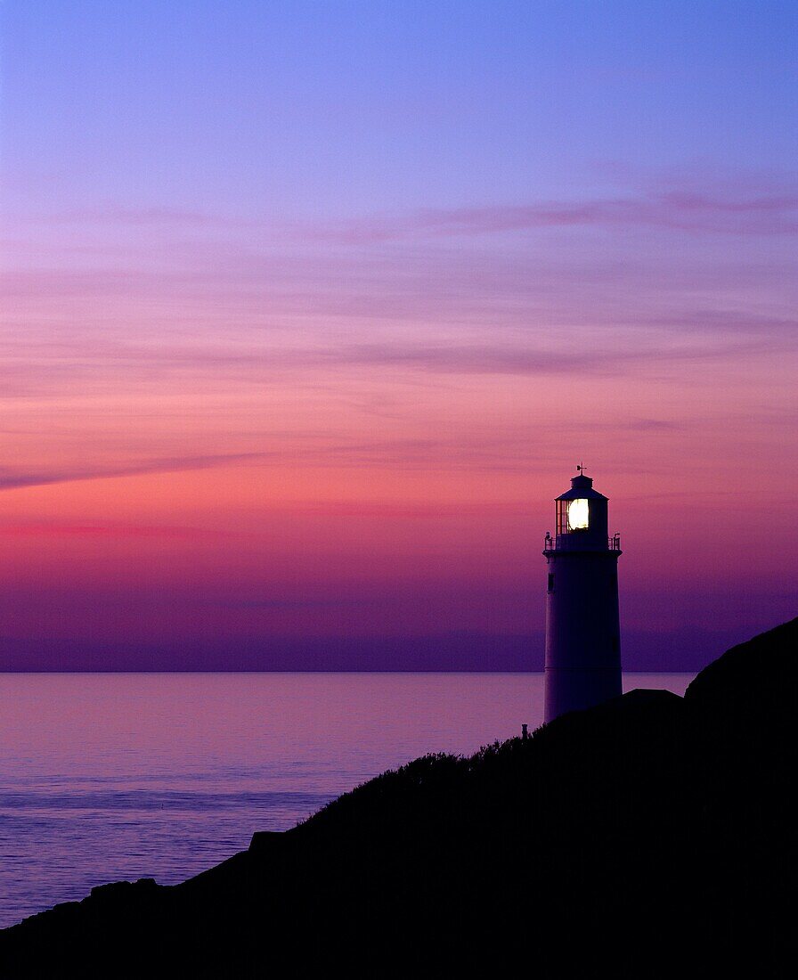 Silhouette of the lighthouse at Trevose Head at dusk on the North Cornwall coast near Padstow, Cornwall, England, United Kingdom