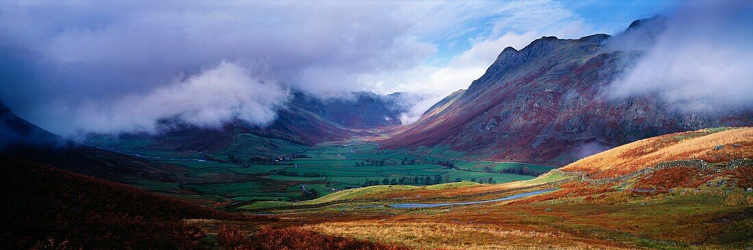 Bow Fell and Langdale Pikes surrounded by low cloud from Wrynose Fell in the Lake District National Park near Chapel Stile, Cumbria, England, United Kingdom