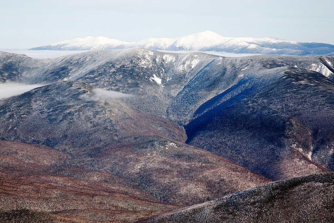 Scenic view from the summit of Mount Lafayette during the winter months in the White Mountains, New Hampshire USA Mount Washington is off in the distance