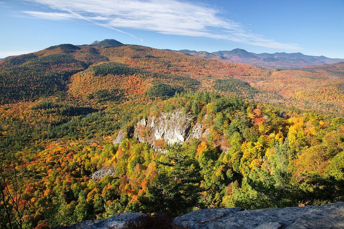 Autumn foliage from the Boulder Loop Trail This trail is located along the Kancamagus Highway route 112, which is one of New England's scenic byways in the White Mountains, New Hampshire USA Mount Chocorua is in the distance