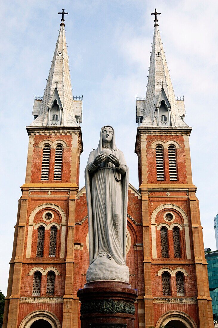 The twin towers of the Notre Dame Cathedral Ho Chi Minh City Vietnam are tipped with iron spires