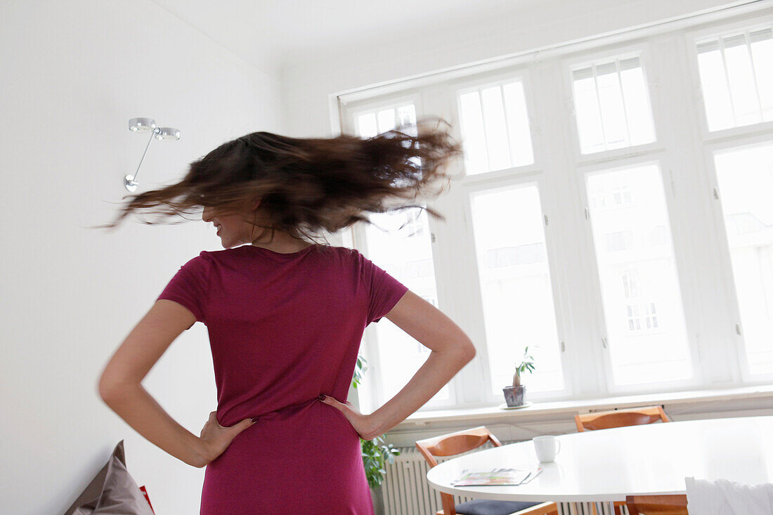 Young woman turning around, Munich, Bavaria, Germany