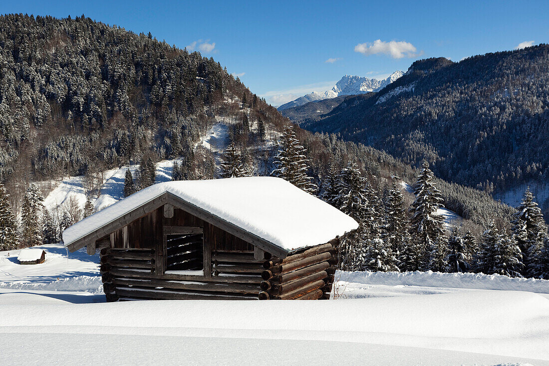 Mountain scenery with hay barn in winter, Upper Bavaria, Germany, Europe