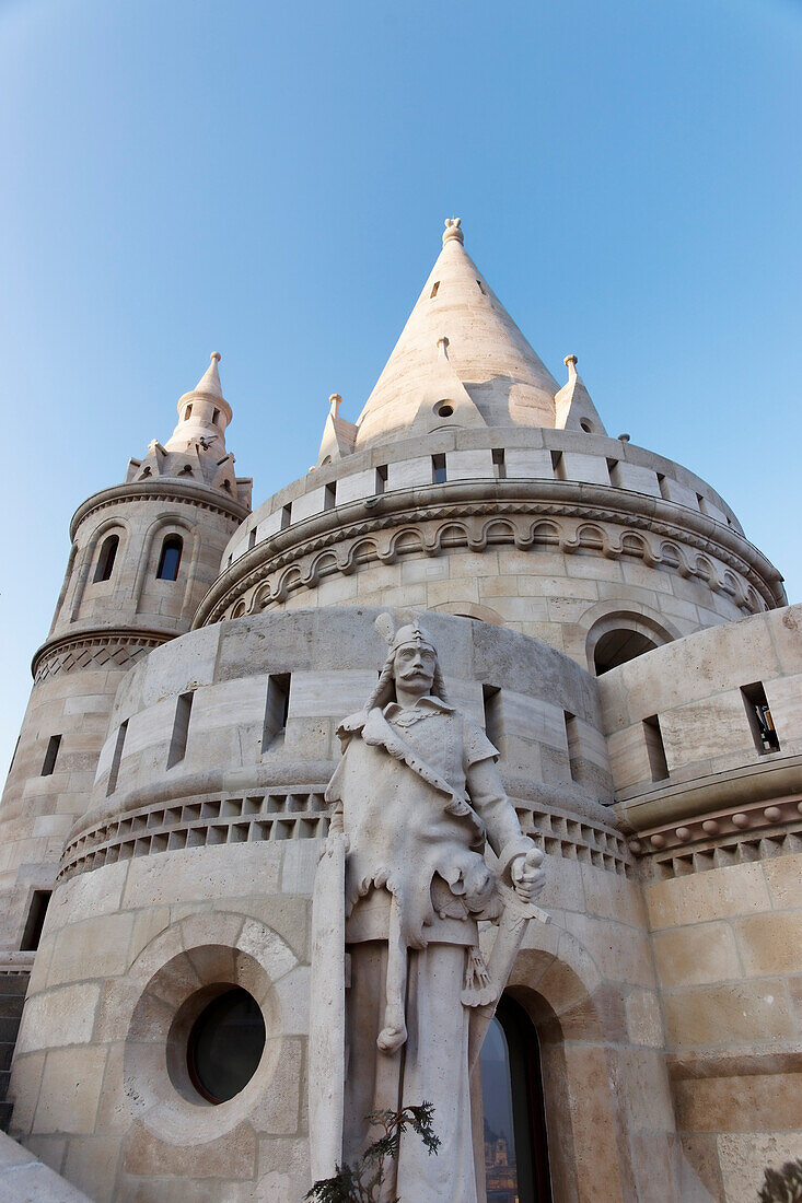 View of the Fisherman's Bastion and a statue on the half landing form below, Budapest, Hungary