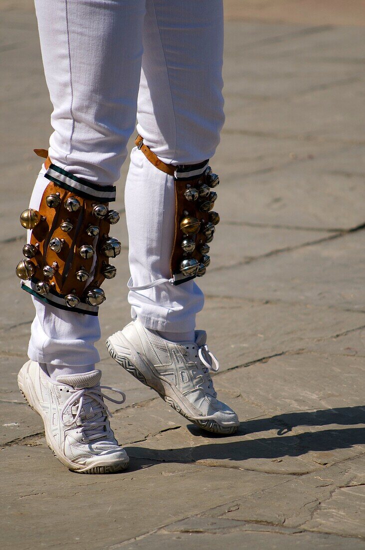 Detail of Morris dancers,  legs in action with bells on