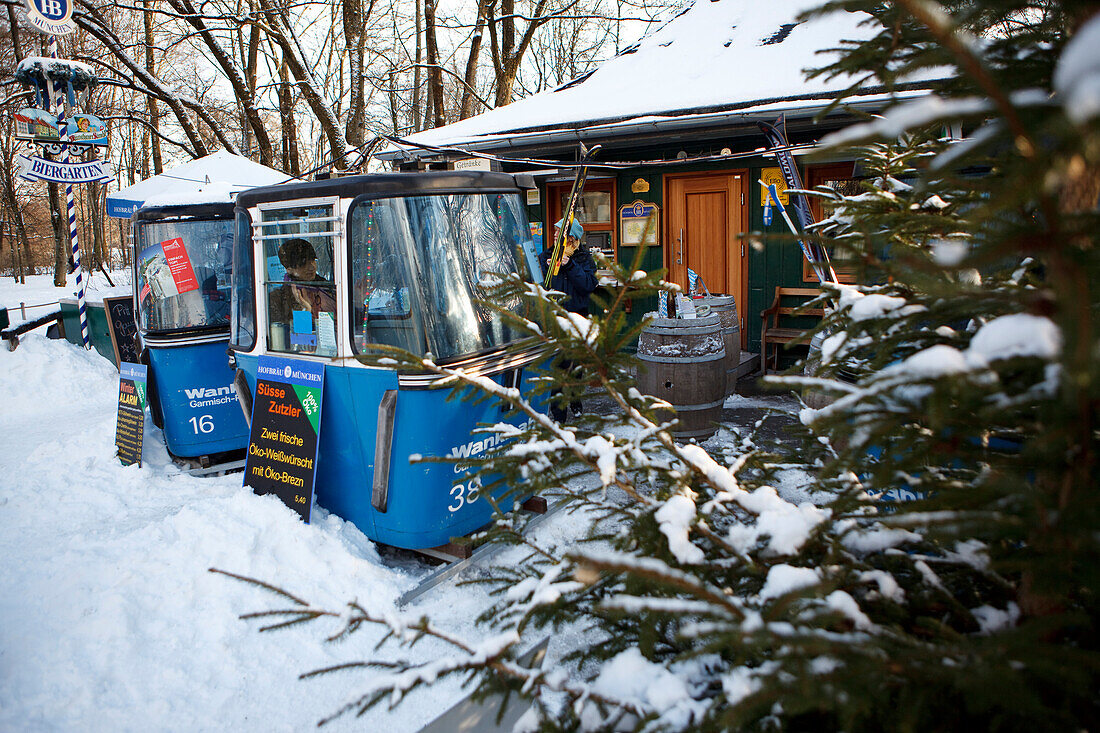 Snow-covered beer garden with gondolas