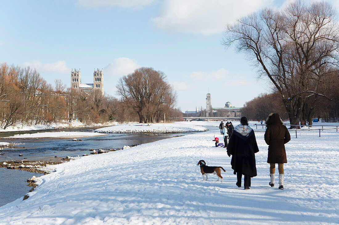 People walking along river Isar in winter, Munich, Bavaria, Germany