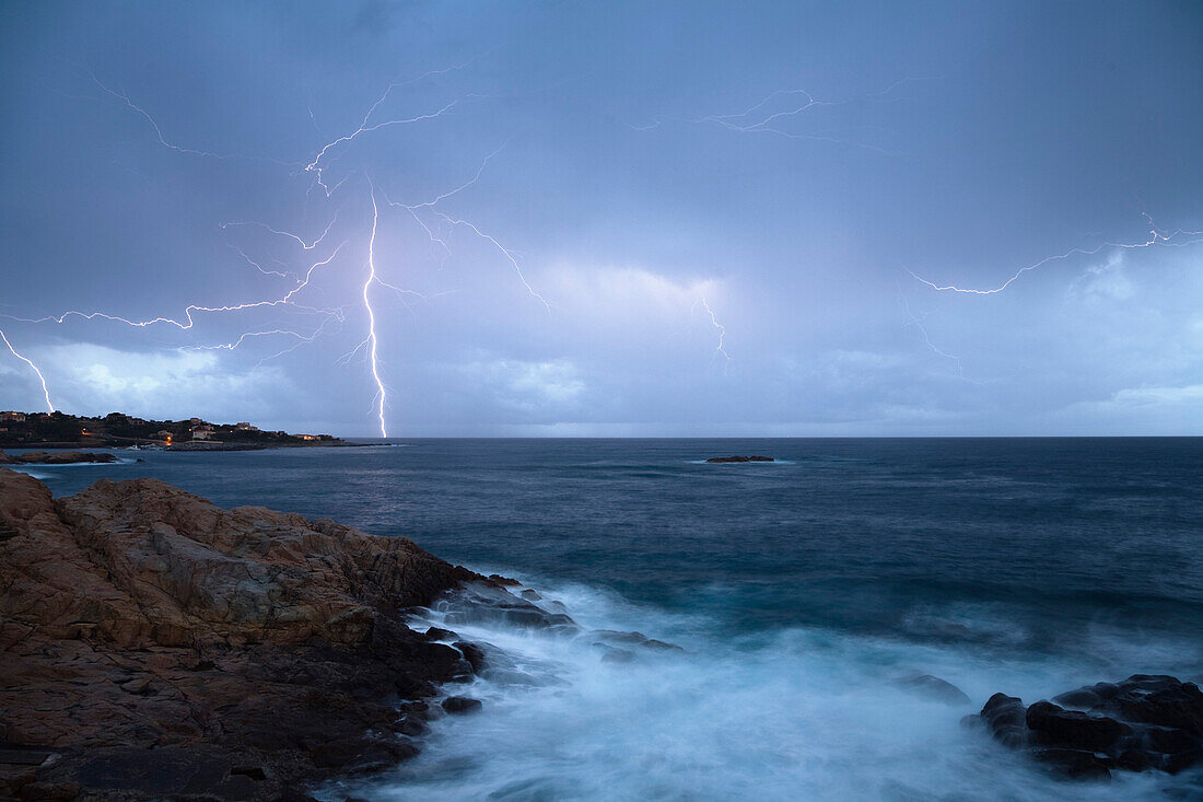 Thunderstorm and surf in Algajola Bay, North-west coast, Balagne region, Corsica, France, Europe