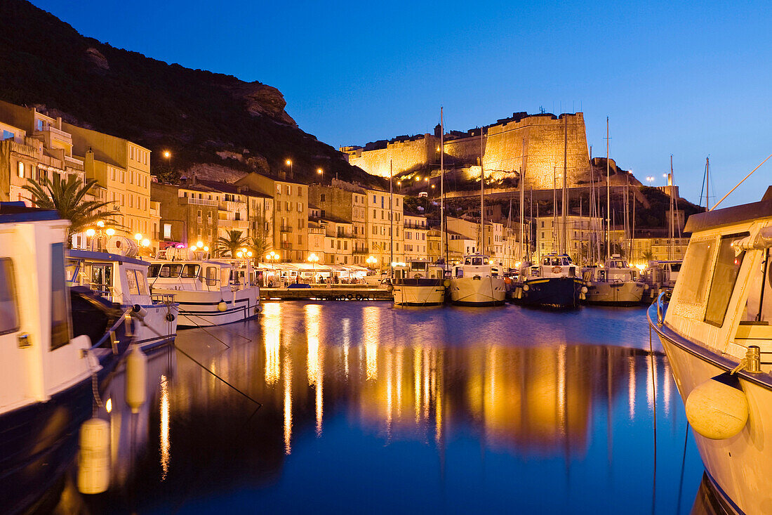 View over harbor to citadel at nicht, Bonifacio, Corsica, France