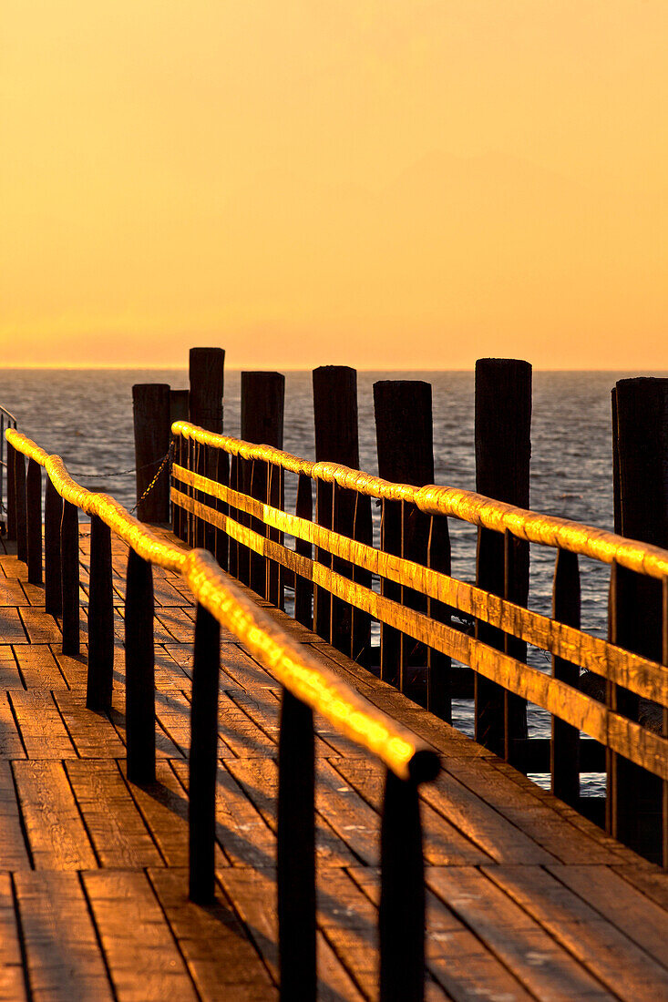 Wooden jetty in the morning light, Fraueninsel, Chiemsee, Chiemgau, Upper Bavaria, Bavaria, Germany