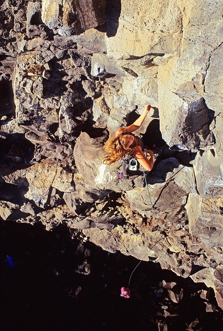 Tracey Weber rock climbing a route called Sanitary Landfill which is rated 5, 10 and located in The Alcove Area at Dierkes Lake Idaho USA