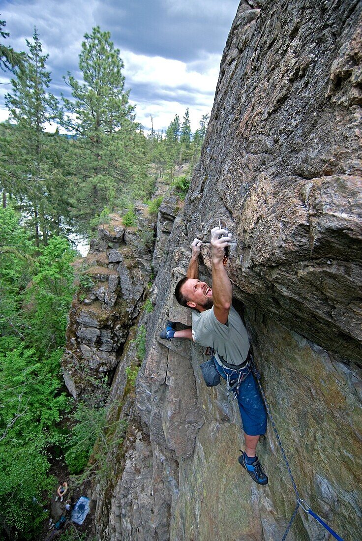 Greg Moore rock climbing a route called Frostbite which is rated 5, 10 at Post Falls in northern Idaho USA