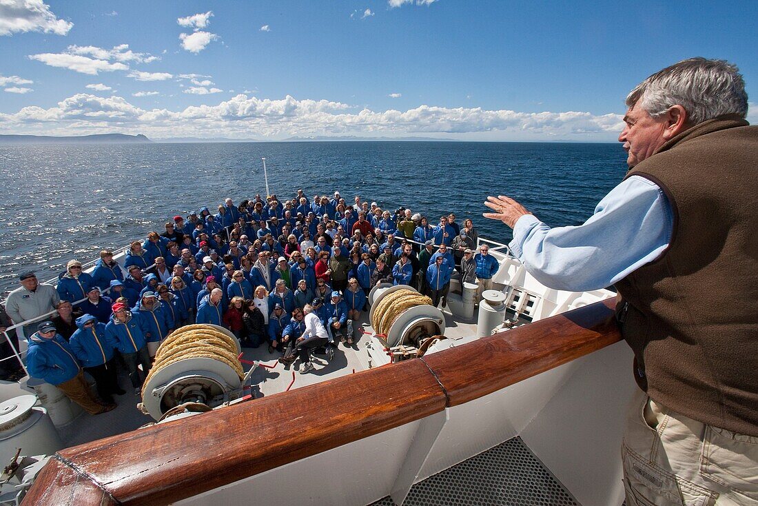 Exclusive Resorts guests from the Lindblad Expedition ship National Geographic Explorer pose for a photo on the bow MORE INFO Lindblad Expeditions pioneered Antarctic travel in December 1969 and remains one of the premier Antarctic Expedition providers t