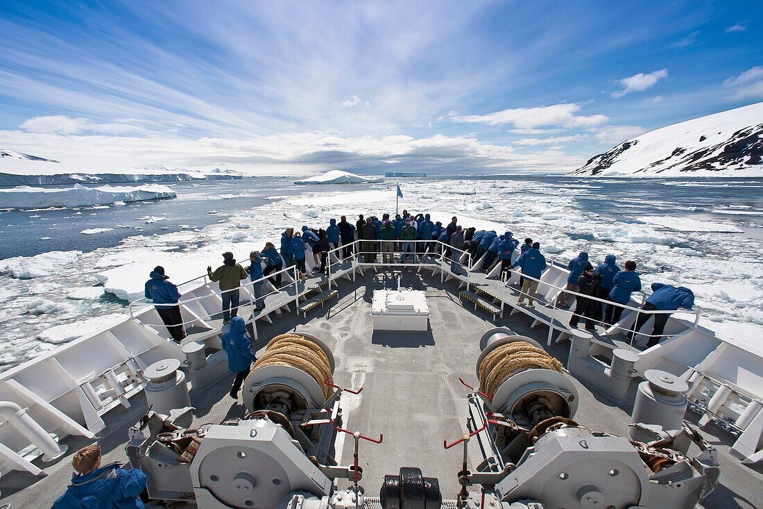 The Lindblad Expedition Ship National Geographic Explorer pushing through pack and sea ice in Antarctica in the summer months