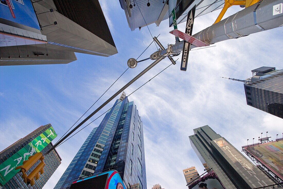 Looking up at the skyscrapers in Times Square in New York City, New York