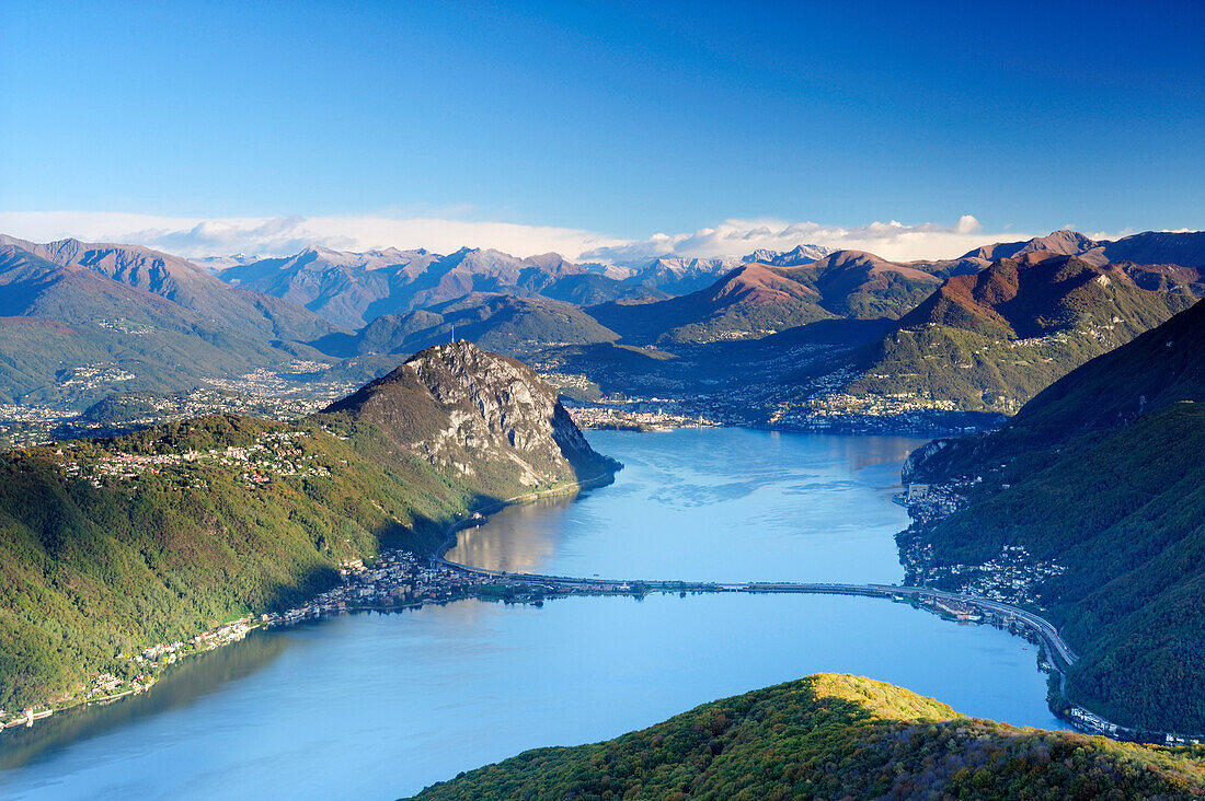 Lake Lugano, Monte San Salvatore and Lugano with Ticino range in background, View from the Monte San Giorgio, UNESCO World Heritage Site Monte San Giorgio, lake Lugano, Ticino range, Ticino, Switzerland, Europe