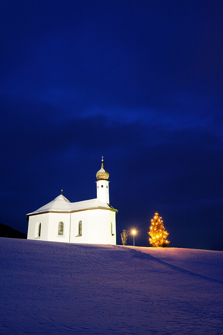 Illuminated chapel with Christmas tree, lake Achensee, Tyrol, Austria, Europe