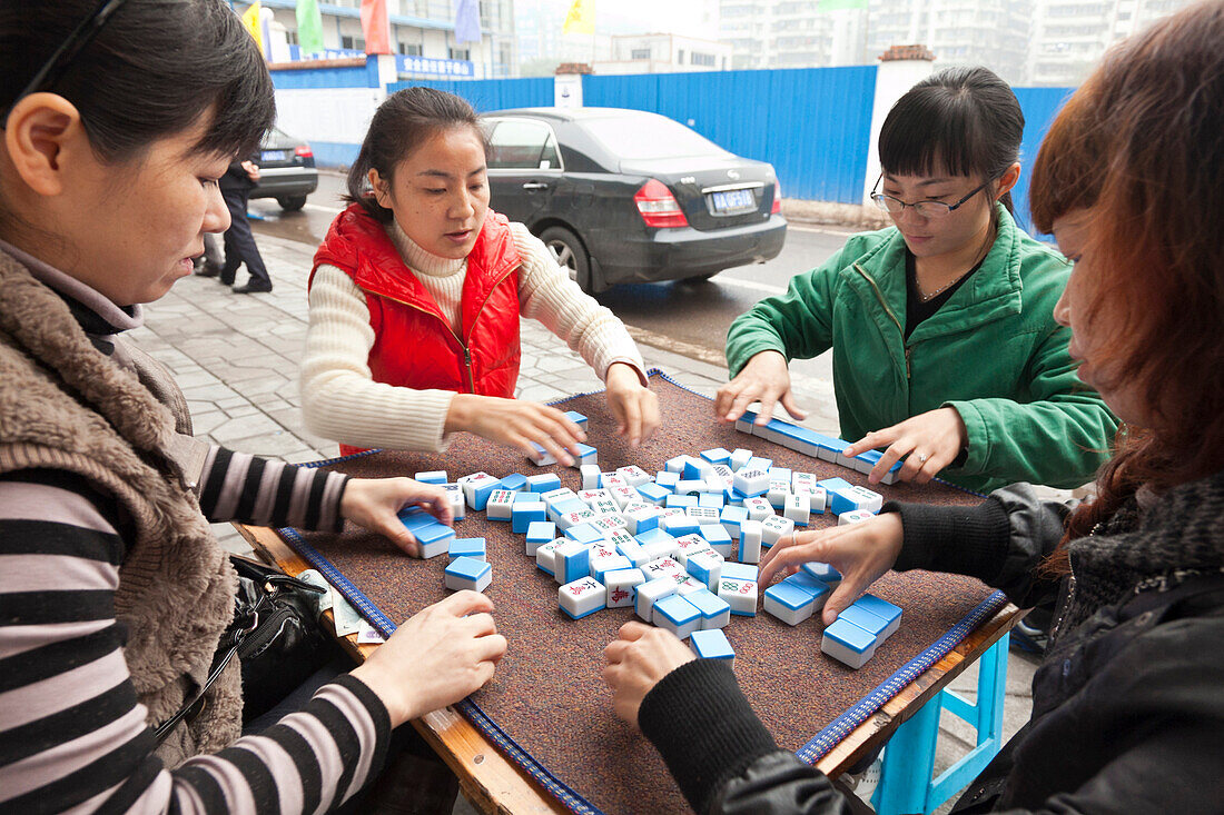 Women playing Majiang, Mahjong, Chinese board game, on the street, Chongqing, People's Republic of China