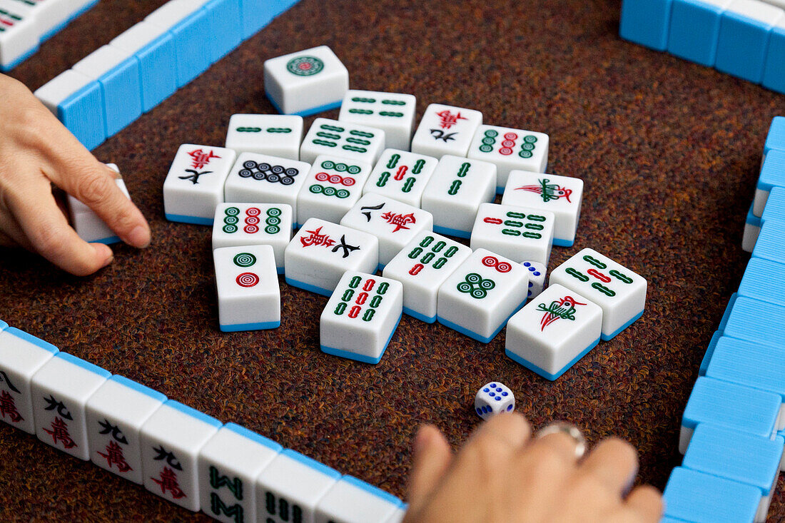 Women playing Majiang, Mahjong, Chinese board game, on the street, Chongqing, People's Republic of China