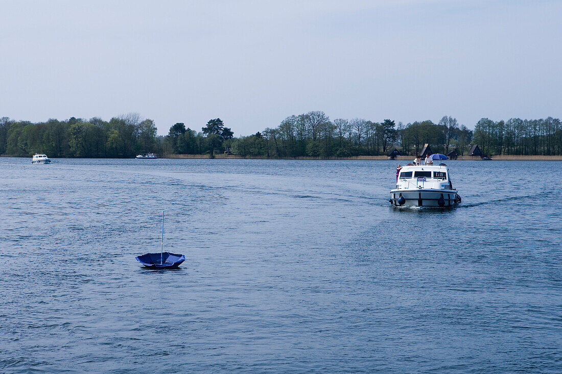 Houseboat on a lake near Zechlinerhütte, North Brandenburg Lake District, Brandenburg, Germany
