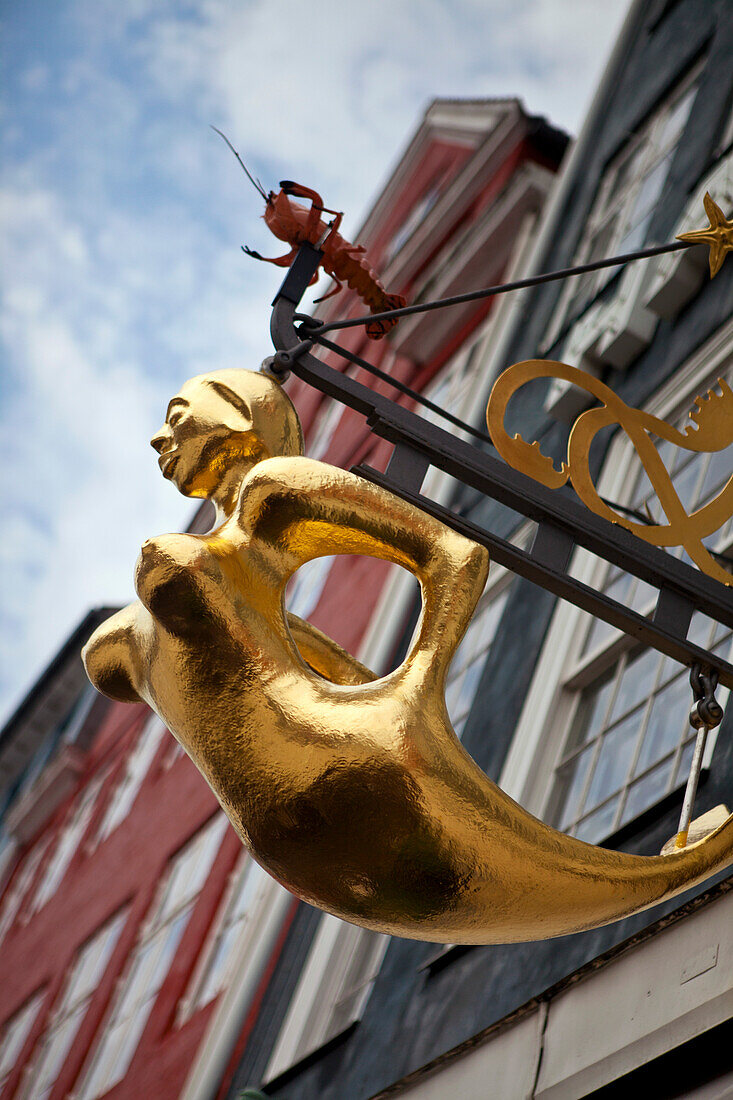 Mermaid sculpture on a guild house, Nyhavn, Copenhagen, Denmark