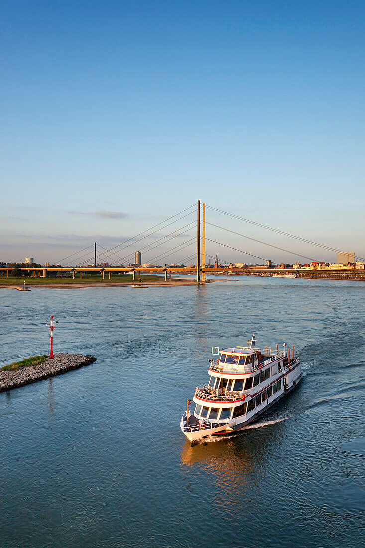 Ship on river Rhine and Rheinknie Bridge, view towards the city, Düsseldorf, Duesseldorf, North Rhine-Westphalia, Germany, Europe