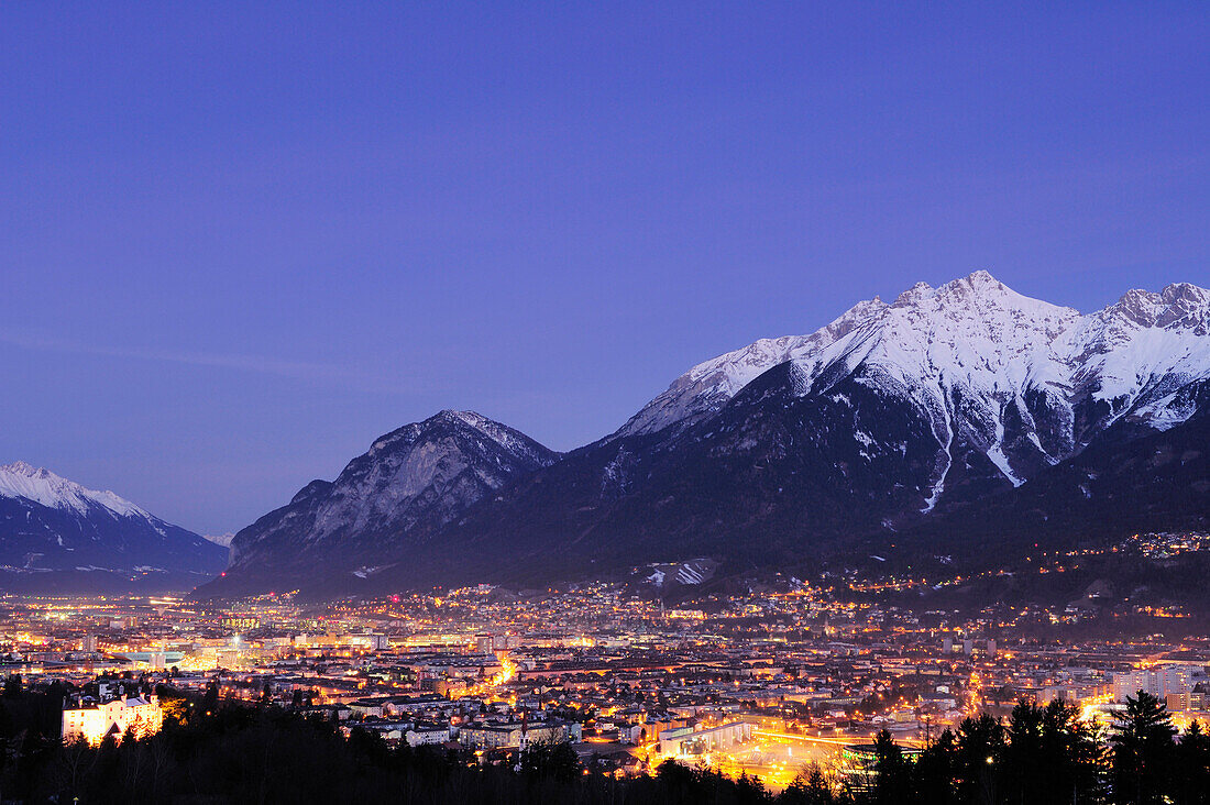 Innsbruck by night with Northern range of Karwendel in background, Innsbruck, Tyrol, Austria, Europe