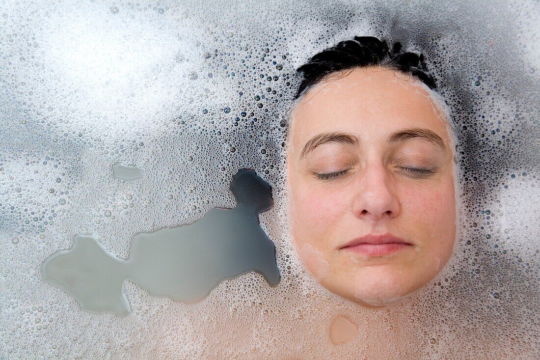 young woman face having a bath