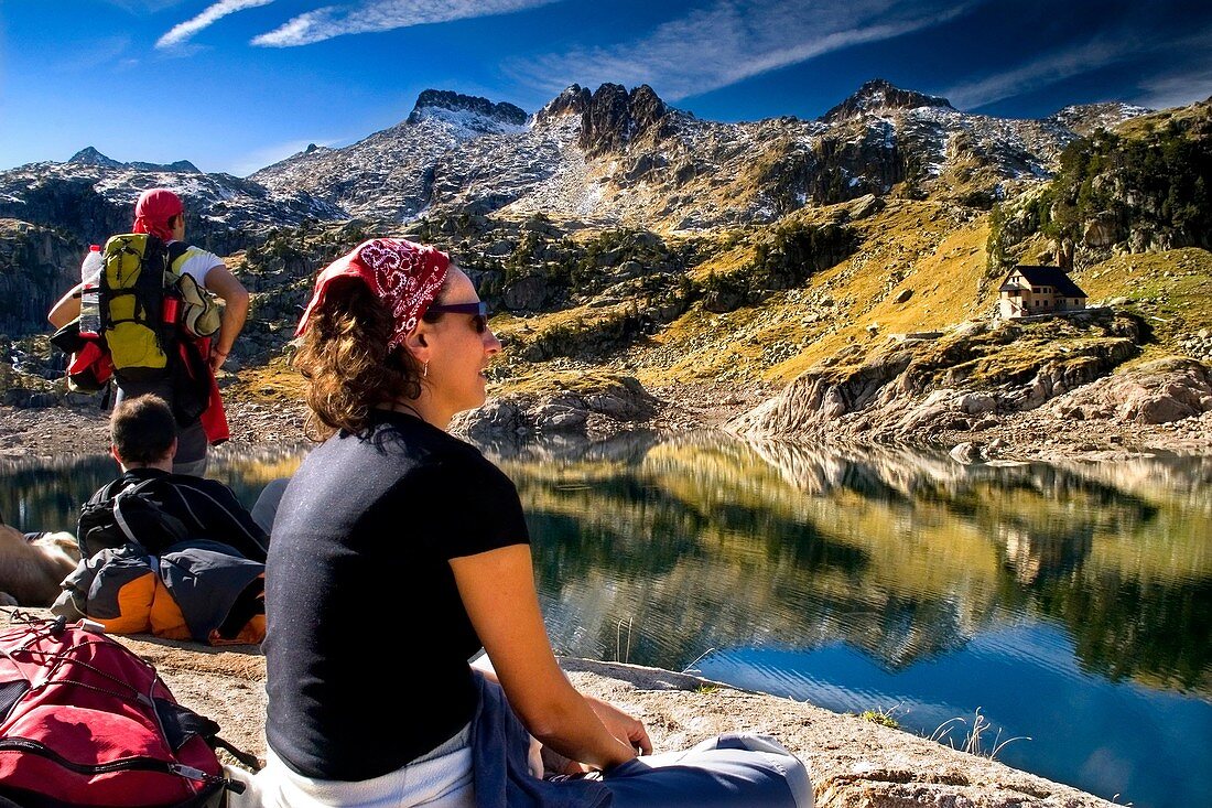 people near the Bigger Lake of Colomer and Colomer I mountain hut Colomers glaciar cirque Aran Valley Pyrenees mountain range Lerida province Catalonia, Spain, Europe