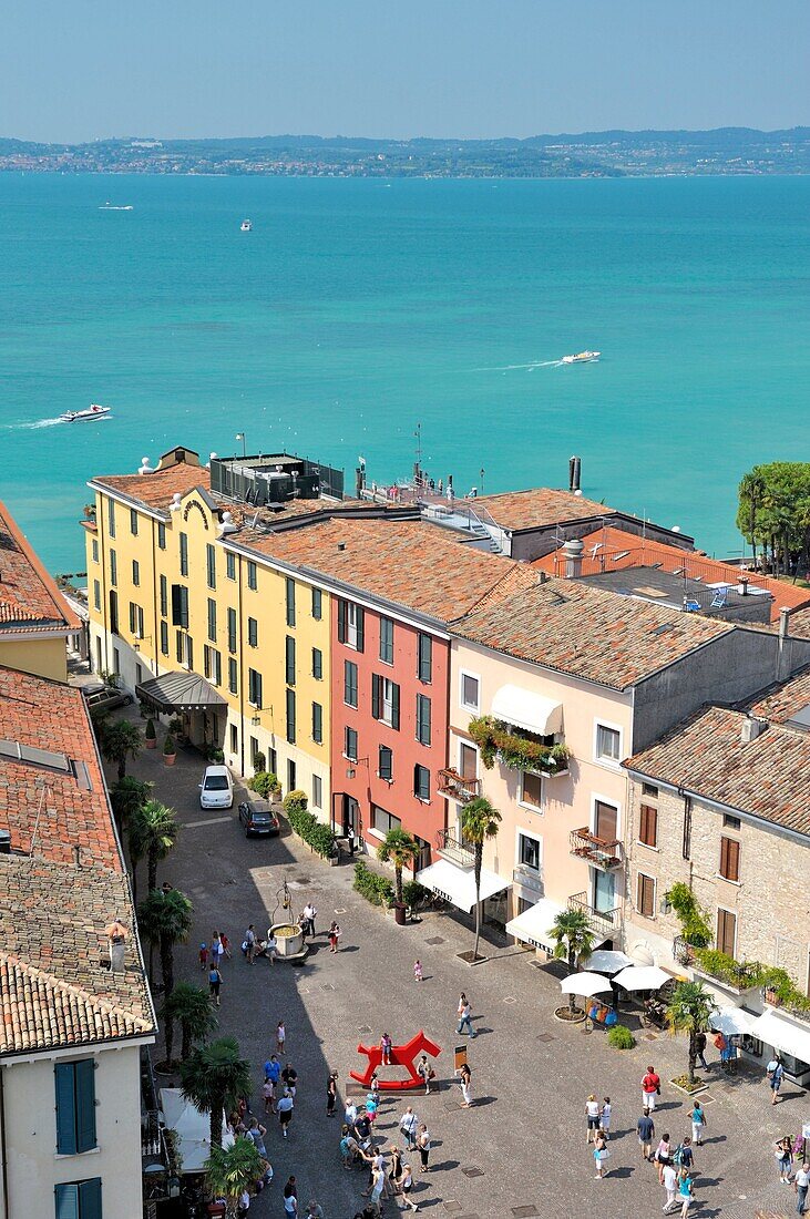 The holiday resort town of Sirmione on Lake Garda, Lombardy, Italy From the castle over Piazza Castello to Lago di Garda