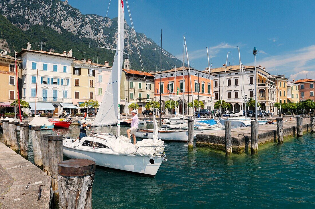 The holiday resort town of Gargnano on Lake Garda, Lombardy, Italy Sail boat leaving the harbour Lago di Garda