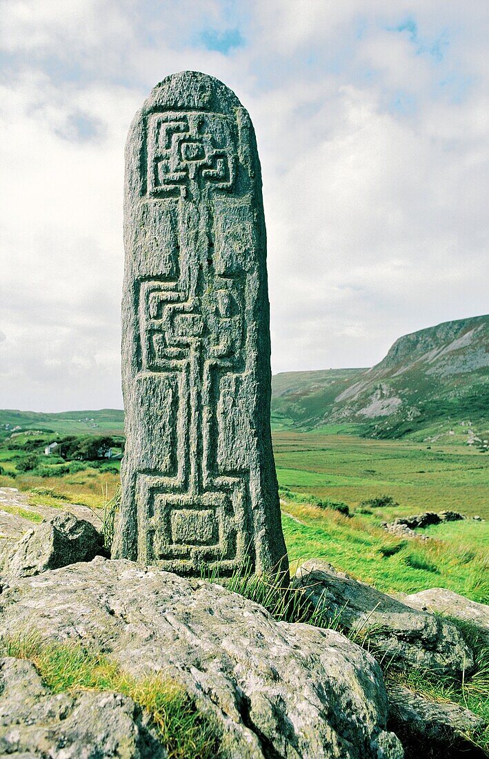Celtic Christian stone carving in the valley of Glencolumbkille, Donegal, Ireland One of the pilgrimage circuit stations