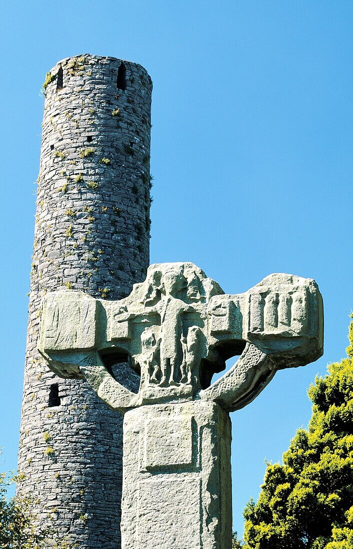 The Unfinished Cross and Round Tower in Celtic Christian churchyard at Kells in County Meath, Ireland
