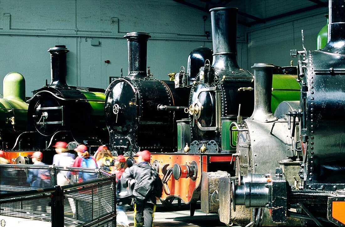 School children and old vintage steam locomotives in the National Railway Museum in the city of York, North Yorkshire, England