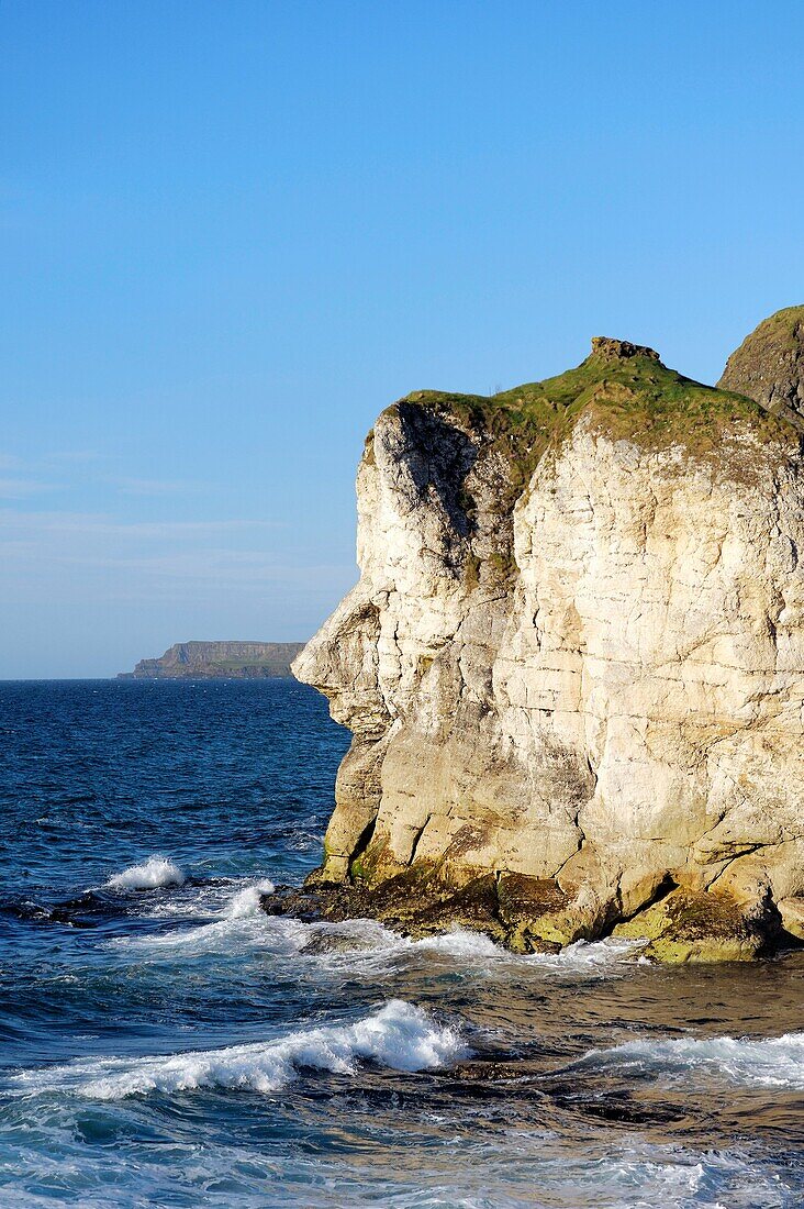 The Giants Head limestone cliff landmark at the White Rocks near Portrush, Northern Ireland Looking east to the Giants Causeway headlands