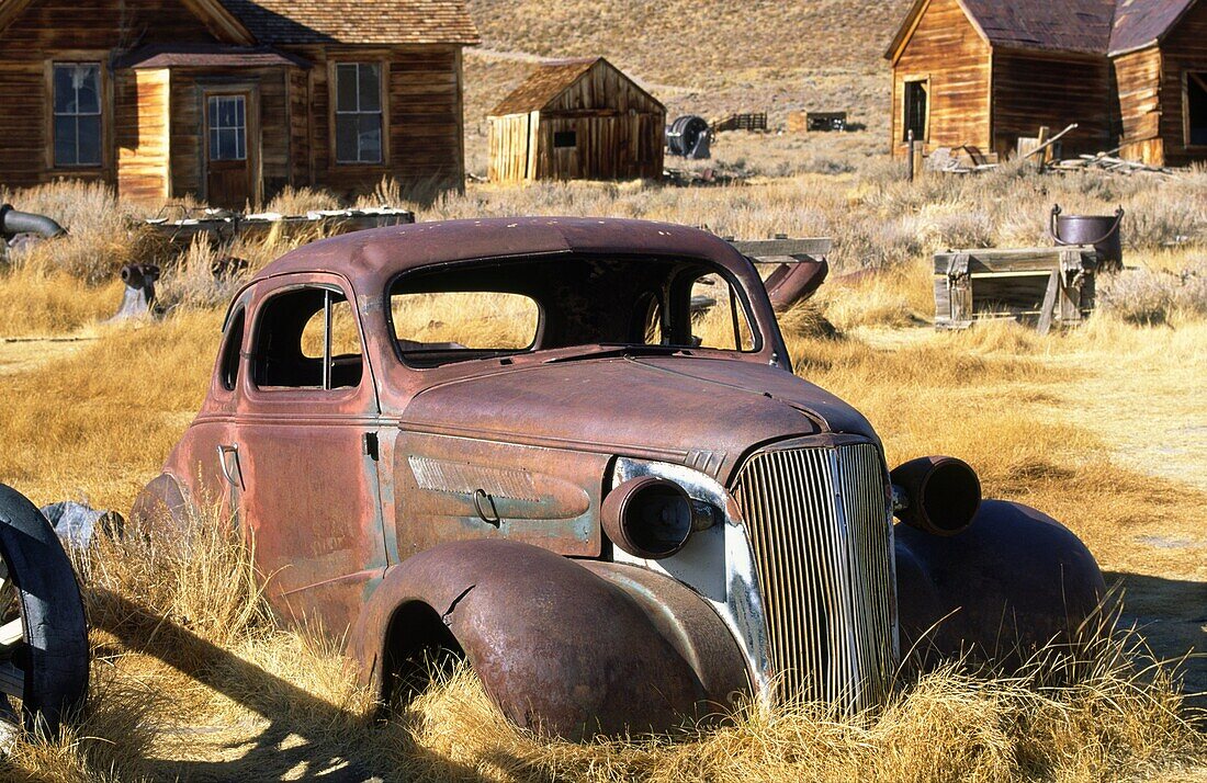 Abandoned vintage car automobile in the gold rush gold mining ghost town of Bodie in northern California, USA