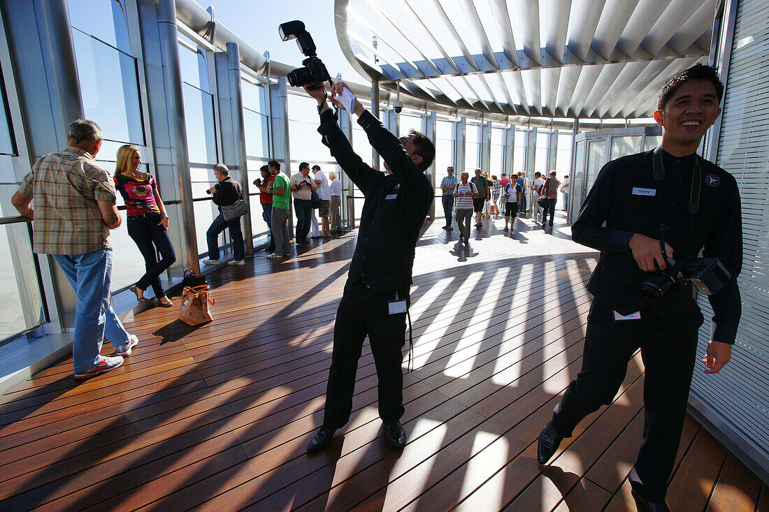 Tourists and photographers on the Observation Deck, At The Top, Burj Khalifa, Burj Chalifa, Dubai, United Arab Emirates, UAE