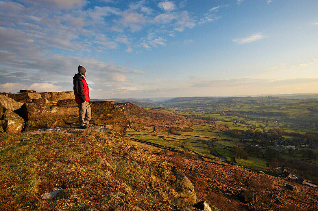 Hiker at Curbar Edge, Peak District National Park, Derbyshire, UK - England