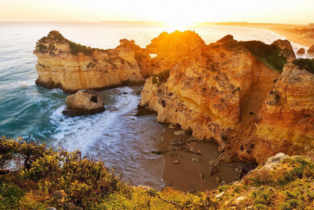 View over Praia dos Tres Irmaos at sunset, Alvor, Algarve, Portugal