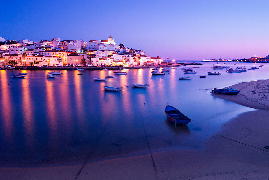 View to coastal village at night, Ferragudo, Algarve, Portugal