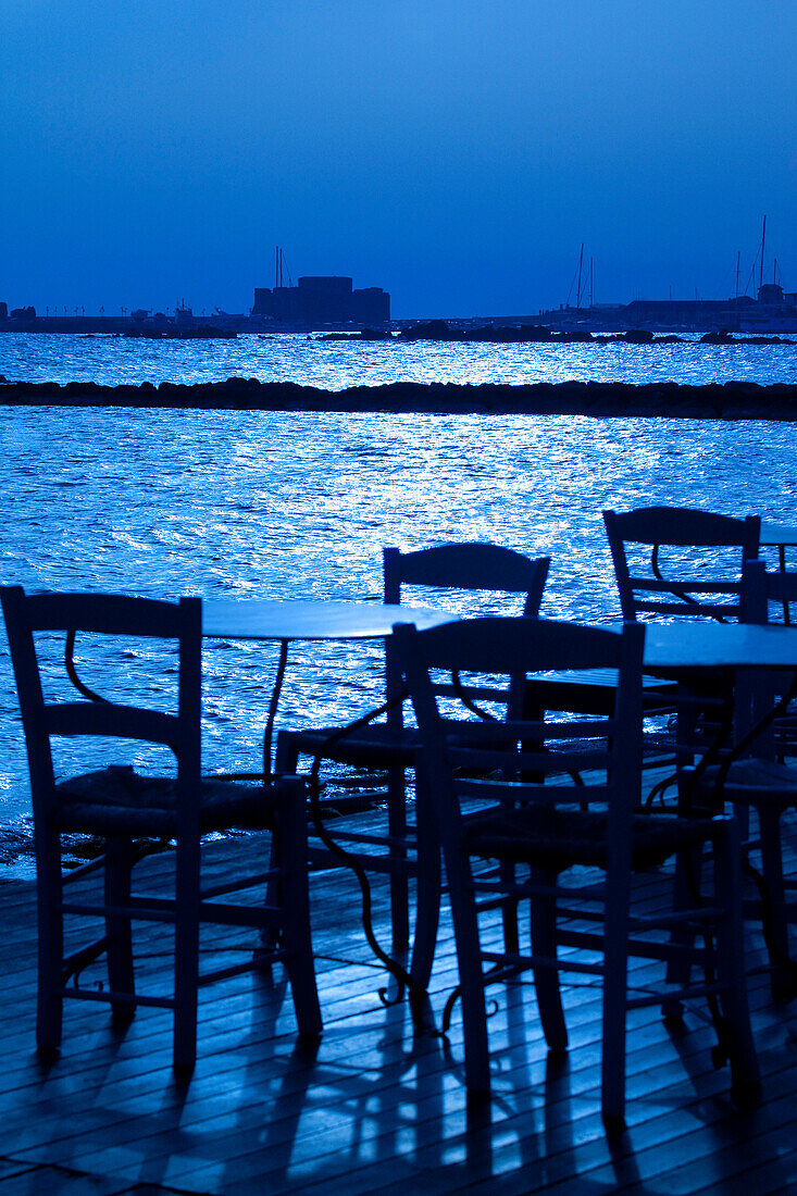 Cyprus, Paphos, Castle & Harbour, Table & Chairs at sunset, Paphos, South Cyprus, Cyprus