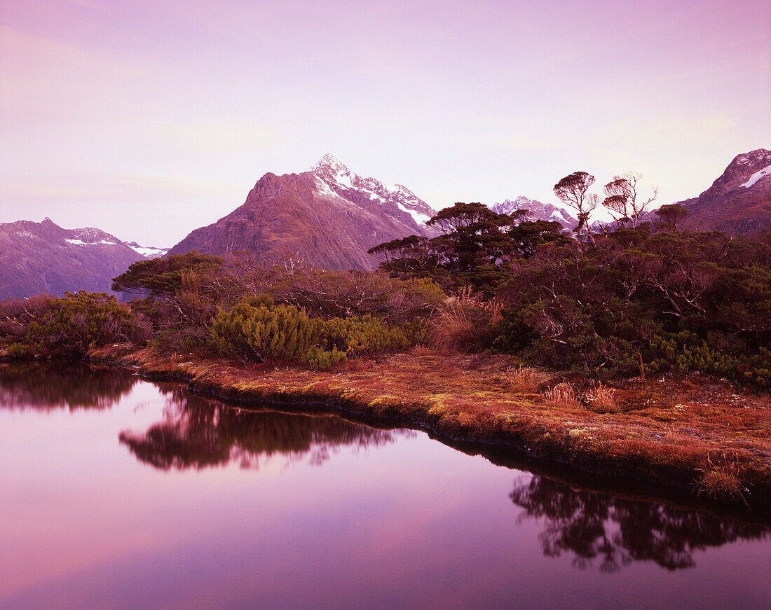 Mount Christina from Key Summit Tarn at dawn, Fiordland National Park, South Island, New Zealand