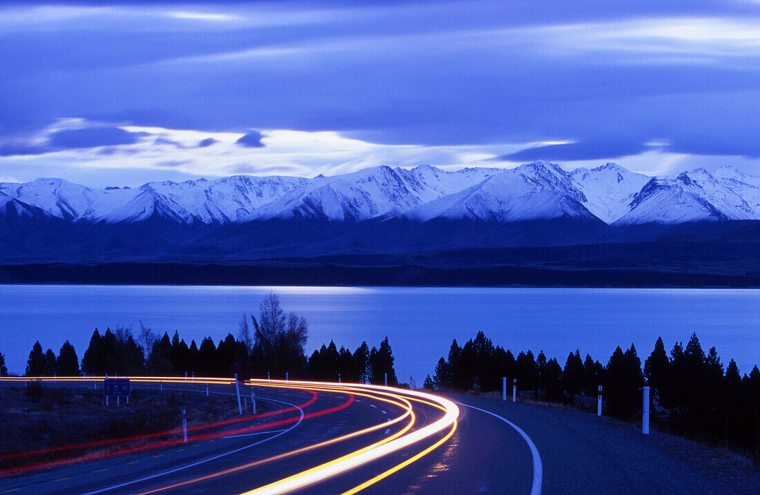 Traffic on State Highway 8 with view to Ben Oahu range, Lake Pukaki, South Island, New Zealand