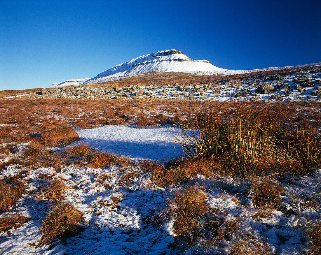 View to Pen y ghent over frozen pool, Ribblesdale, Yorkshire, UK - England