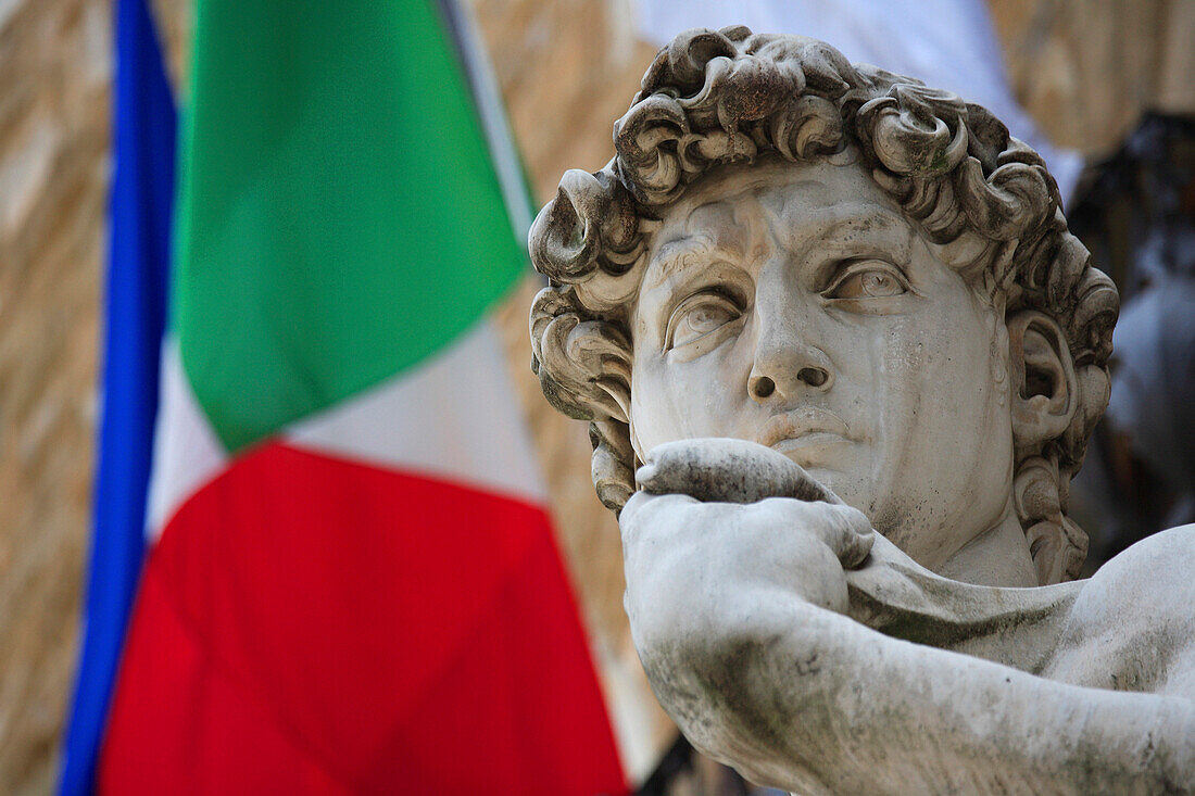 Flag and statue of David in Piazza della Signoria, Florence, Tuscany, Italy