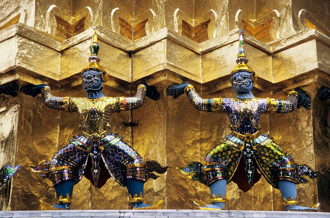 The statue of Demon Yaksha, character from the Ramakien epic at golden chedi, Wat Phra Kaeo palace, Bangkok, Thailand