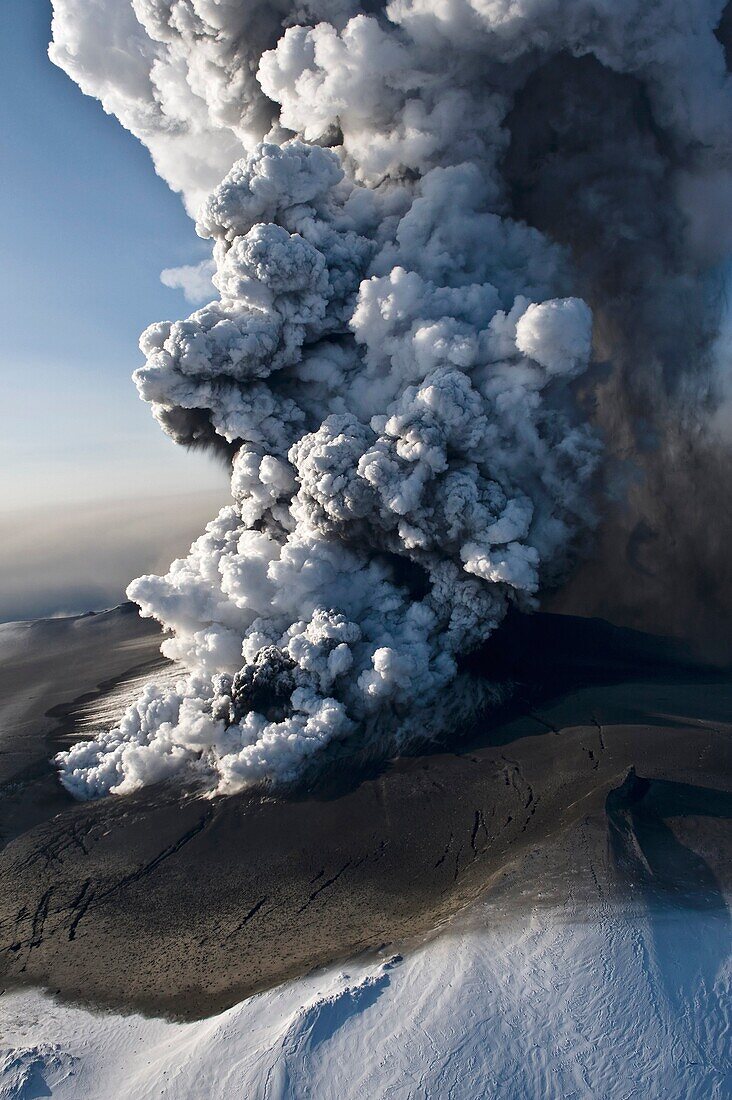 Image of the phreatic explosions at sunrise that produced substantial amounts of ash and steam The ash fall behind the plume is clearly visible