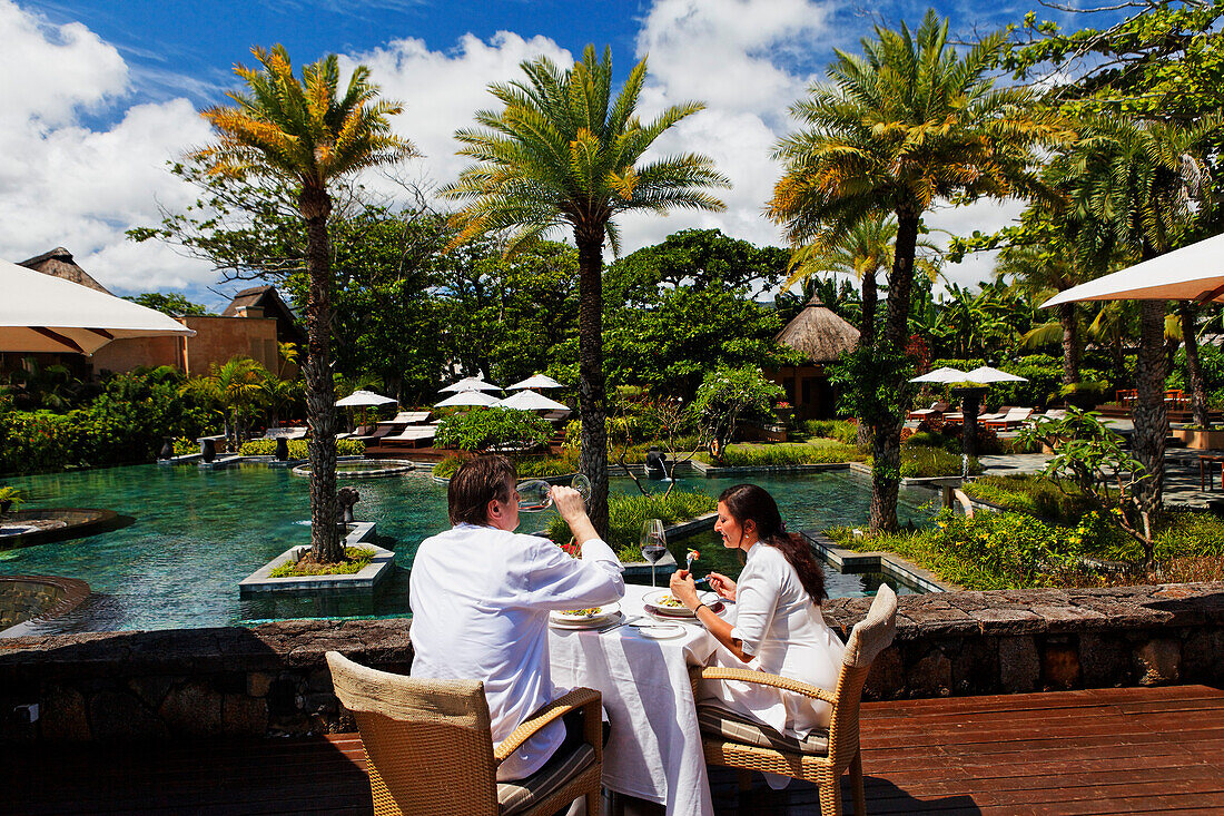 People on the terrace of the restaurant, Shanti Maurice Resort, Souillac, Mauritius, Africa
