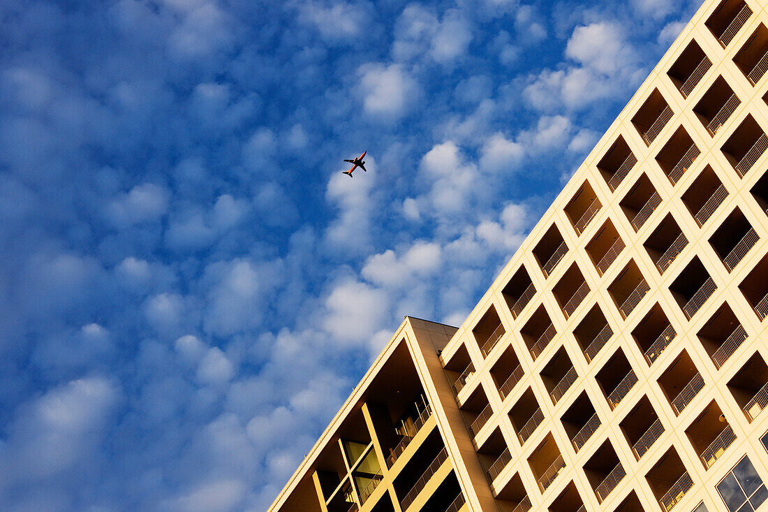 Airplane Flying Over Building, Dallas, Texas, USA